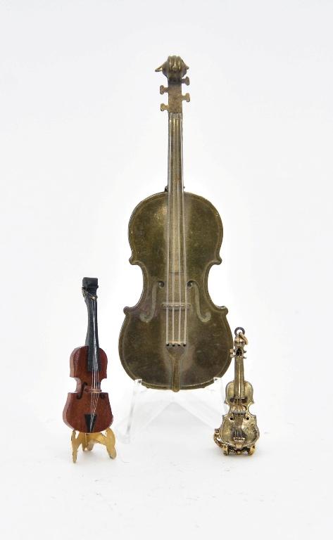 Ralph Partelow Dollhouse Violin & Others: Ralph Partelow mahogany and ebonized wood violin 2 1/16"L, metal violin charm 1 5/8"L, cast metal base with scattered scratches 4.5"L