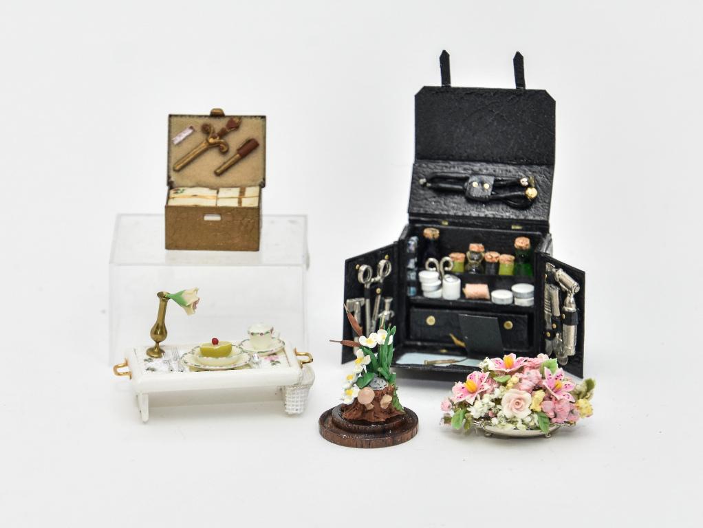 Dollhouse Artisan Miniatures: Very elaborate unsigned doctor's kit 2.5"W, Brook Tucker box of writing paper and utensils 1"W, Joyce S. wood breakfast tray 2"W, bisque flower arrangement on pewter tray, Buckeye artisan flower arran