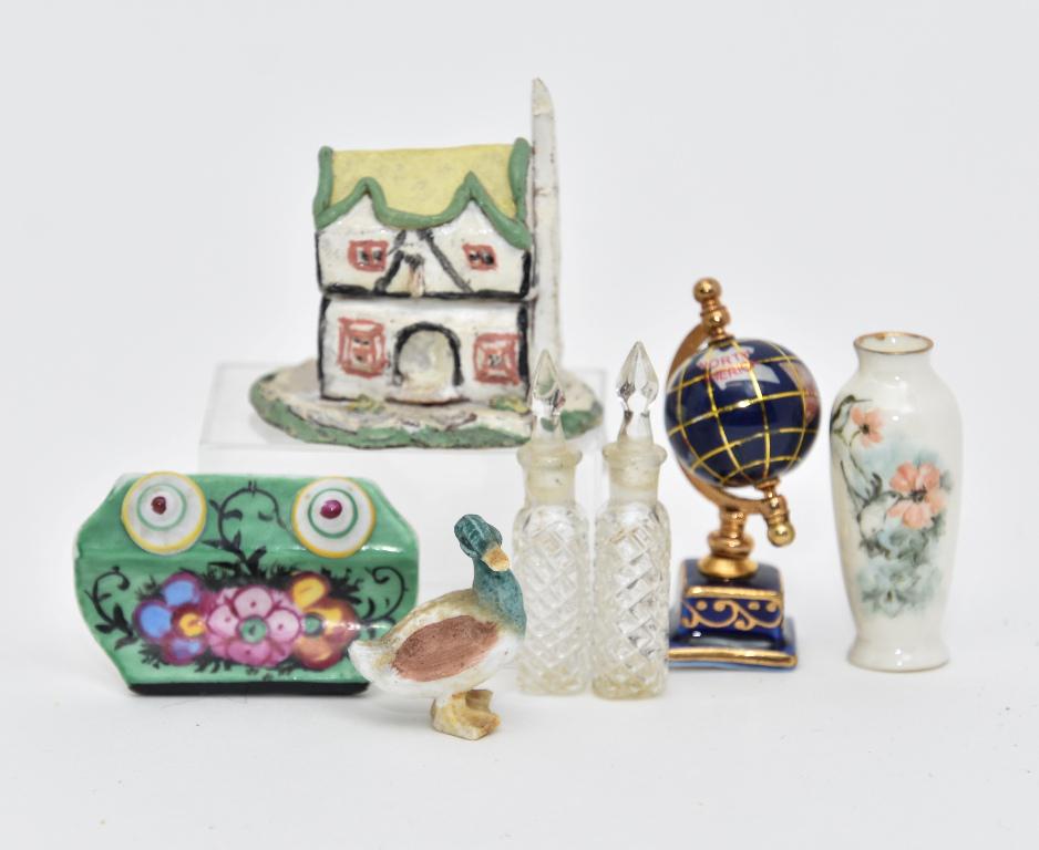 Small Dollhouse Artisan Accessories: Gingerbread house signed LC 1 7/8"W, vintage porcelain pen rest, Ni-Glo hand painted vase, ceramic duck, pair of cut glass decanters 1 3/4"H, porcelain and brass desk globe 2.25"H