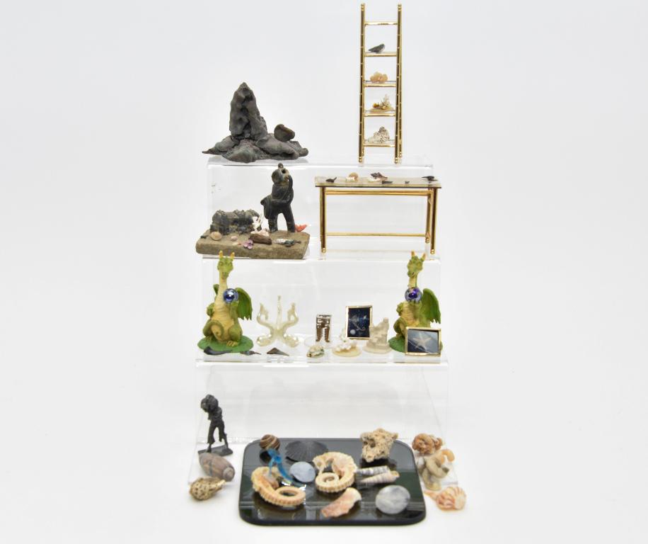 Dollhouse Nautical & Mythical Accessories: Nice selection of small shells on brass table and etagare, diver and treasure chest diorama, volcanic rock, pewter pirate with treasure chest, porcelain dolphin form table base, bisque castle, lots of