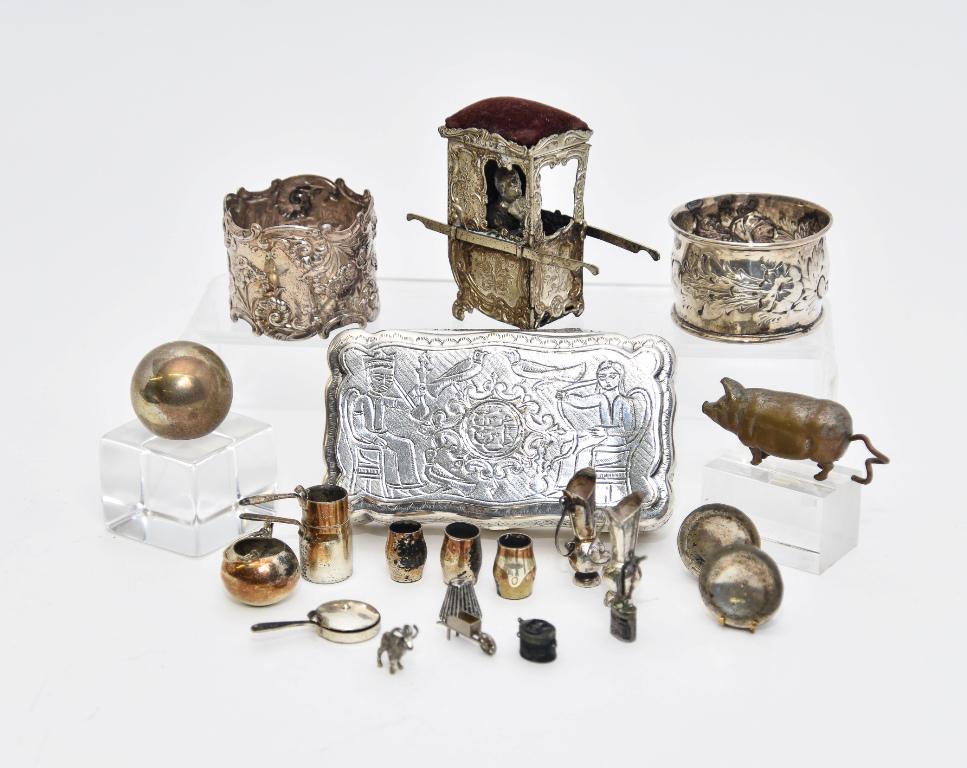 Dollhouse Silver & Silver-Plate Accessories: Pair of silver plates with illegible hallmarks 1"D, sterling skillet with lid, sterling marked teapot with three unsigned glasses, pair of unsigned silver ewers 1 3/8"H, unmarked silver ram, wheelbarr