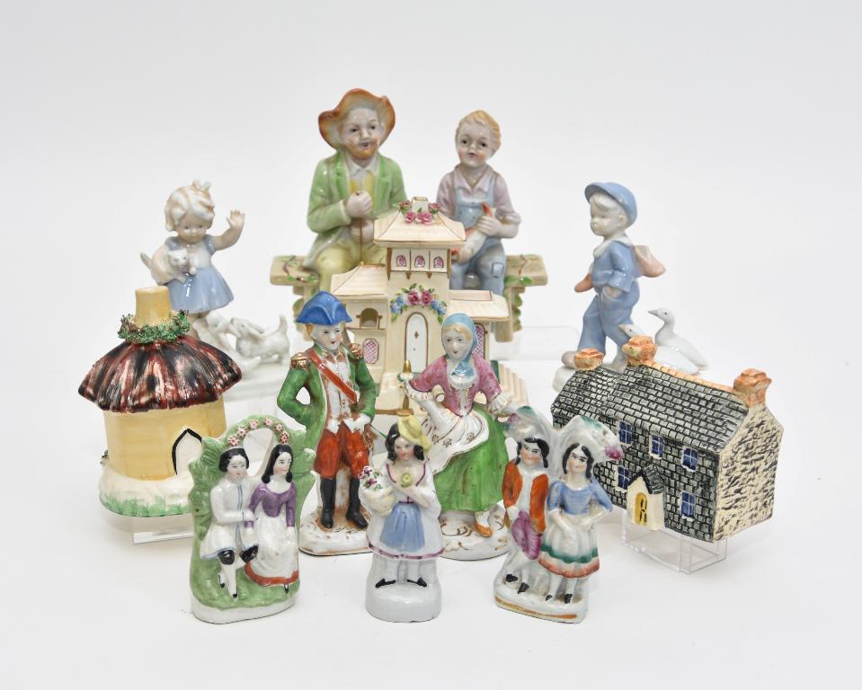Porcelain Houses & Small Figures: Coalport bone china house 4.75"H, John Putnam Welch house 4.5"W, English octagon cottage 3"D, five Staffordshire style figures tallest 5.25"H, bisque two boys on bench fishing 6.5"L, newer Japanese bo