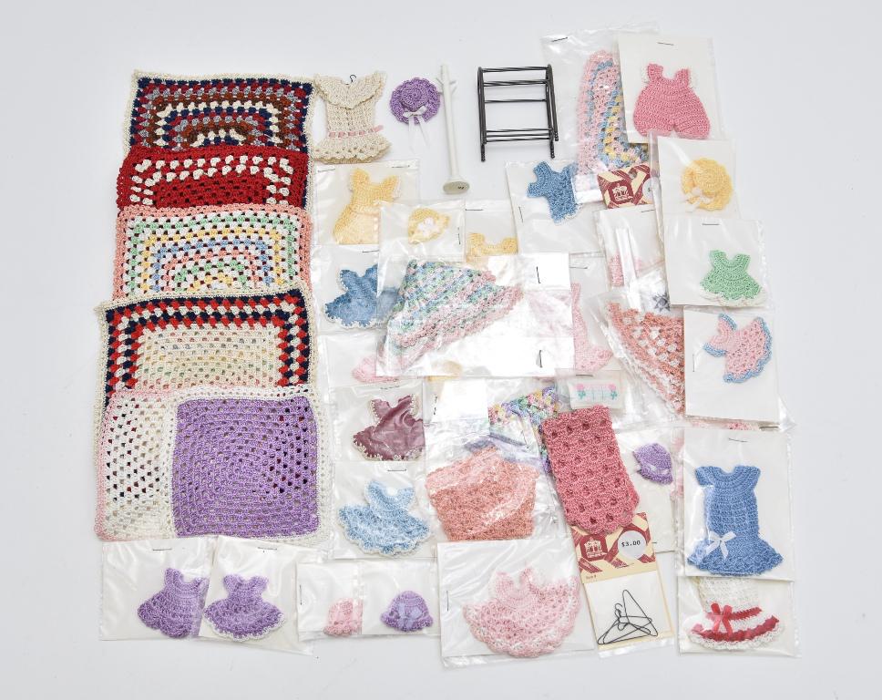 Large Lot of Woven Dollhouse Clothing & Accessories: Nice assortment of woven doll house 1" scale clothing to include 14 child's dresses, 3 child's jumpers, 7 caps and 2 bonnets, 6 shawls, 2 pillows, 2 packs of hangers, 6 quilts with largest 6" square, 