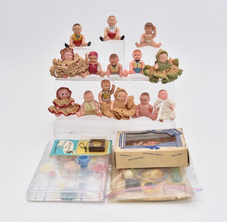 Vintage Dollhouse Dolls & Accessories: Pair of Flagg & Co. baby dolls in original box, 13 Renwal baby dolls and 1 Irwin baby doll, Grandmother Stover accessories on original card 4" by 6"