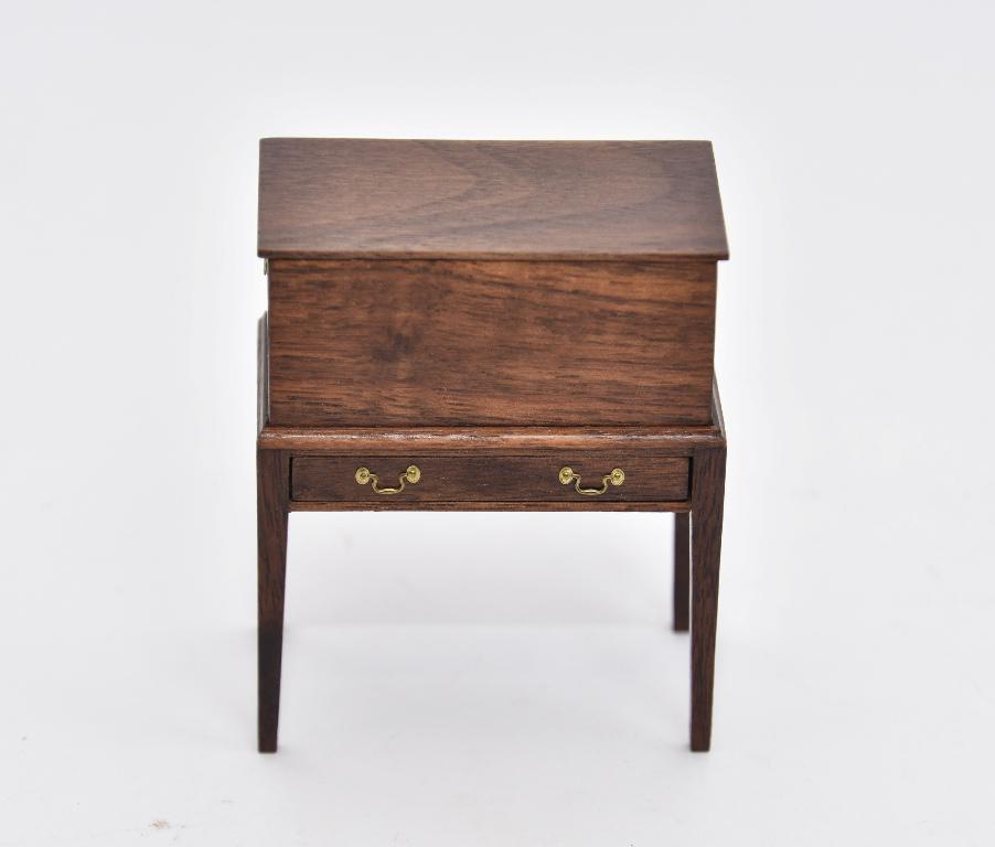 Gary Larsen Mahogany Cellaret on Stand: Gary Larsen mahogany cellaret with hinged lid over a interior divided for bottle storage, sitting on a single drawer base 2.25"W, 1 5/8"D, 3 1/8"H