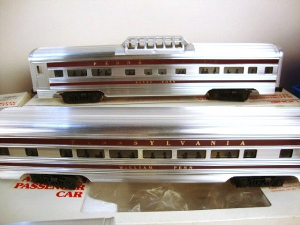 Lionel Aluminum Passenger Cars (5): Five Lionel Aluminum passenger Cars, all with PRR road name, baggage 6-9570, 6-9571 coach, 6-9572 coach, 6-9573 Vista Dome, 6-9574 observation, most have colonial names Molly Pitcher, Alexander Hamilt