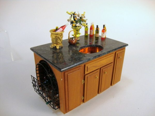 Artisan Kitchen Island: Handsome granite-topped kitchen island with copper sink (missing faucet) and terrific built-in wine cellar plus a cast gilt metal ice bucket, small cloisonné teapot and Kupjack urn filled with flower