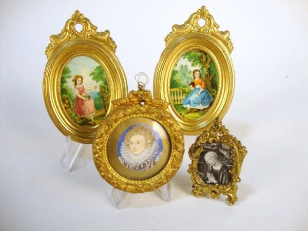 Assortment of Ormolu Framed Pictures: A pair of charming oval prints of small girls in ormolu frames by Erhard & Sohne 3" H, a small framed print of Nicholas Hilliard's portrait of Elizabeth I in a round gilt frame as a souvenir of Windso