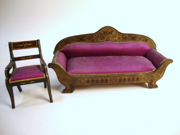 Waltershausen Settee and Chairs: A German settee with gilt transfer decoration featuring Gothic architectural motifs (missing small area of Dresden paper trim) and an armchair with hand-painted decoration, both upholstered in crimson