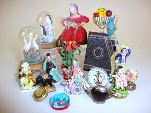 Therese Bahl Silent Companion: A painted dummy board 2" H by Therese Bahl, a Zadar figural group appearing to be from Disney's Beauty and the Beast, several Staffordshire and Meissen style figures and an eclectic assortment of deco