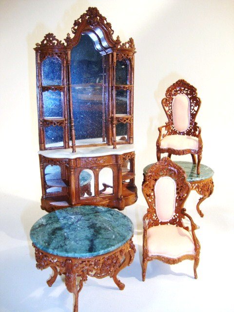 Stan Lewis Belter Furniture: Ornate five-piece suite of Belter furniture including an imposing display cabinet with mirrored back 8.25" H, two intricately carved chairs and a pair of marble-topped tables (one has two broken legs)