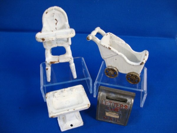 Vintage Cast Iron Toys: Arcade highchair 3.5" H, molded wicker baby carriage, small sink and a tin US Mail letterbox. Some wear and paint loss.