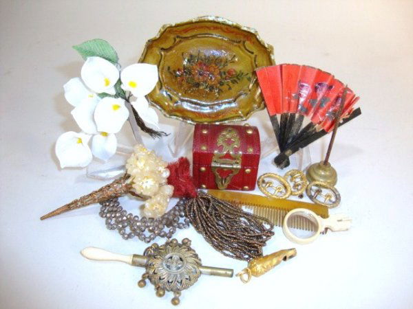 Doll's Dressing Table Accessories: A variety of interesting antique items including a small leather-covered box labeled underneath: "J. Duerr Watchmaker, Center Street, Pottsville, PA", a carved bone umbrella 5" L, a bouquet of wax flo