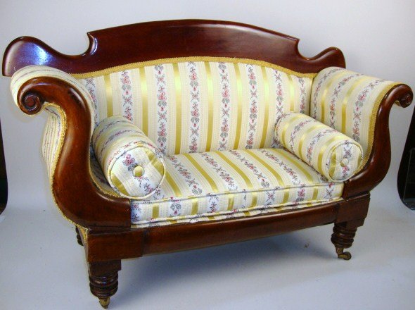 William IV English Settee: Handsome sample-size mahogany settee with turned legs, brass cup casters, rolled arms and newer upholstery. 34" W, 22" H.