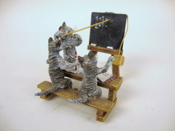 Vienna Bronze Cat Teacher and Students: Vienna Bronze feline teacher with numbers on the chalk board, two students with books on bench. Great colors, expressions, chalk, etc. 2.5" H x 3" L.
