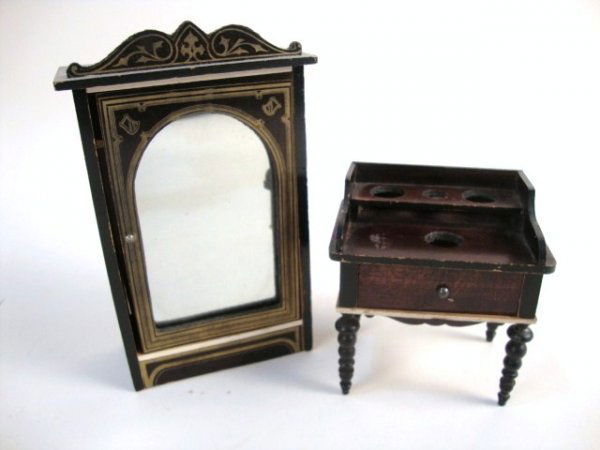 Waltershausen Armoire and Washstand: A Boulle armoire 6" H with original mirror (loose inside) and gilt transfer decoration, and a washstand with elaborately turned legs and cutouts on the table top and shelf.