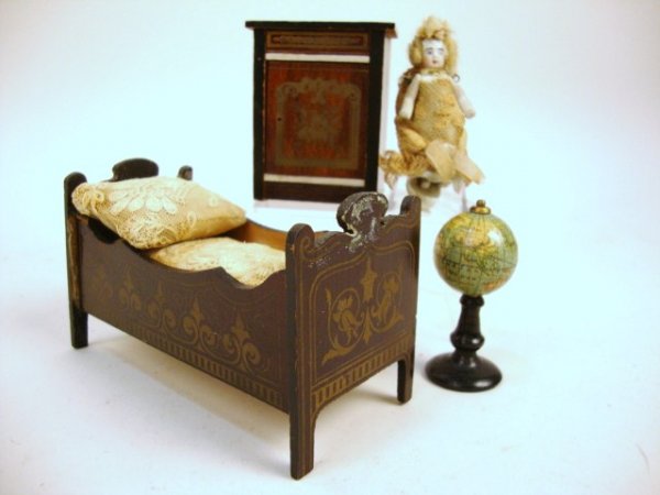 Waltershausen Crib and Globe: A Boulle child's bed (reglued) with small bisque baby with jointed arms, a Boulle nightstand (missing knob) and a very rare revolving globe on stand 2" H.