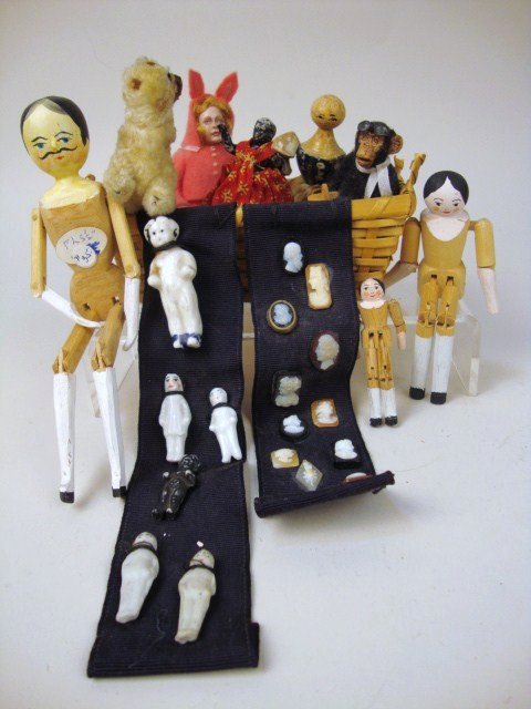 Backstrom, Kruger and Basket of Dolls: Wonderful selection of dollhouse dolls: Todd Kruger monkey '90, Marcia Backstrom bunny child '92, frozen Charlottes, peg wooden dolls, black bisque, and many small cameos. Tallest 6" H.