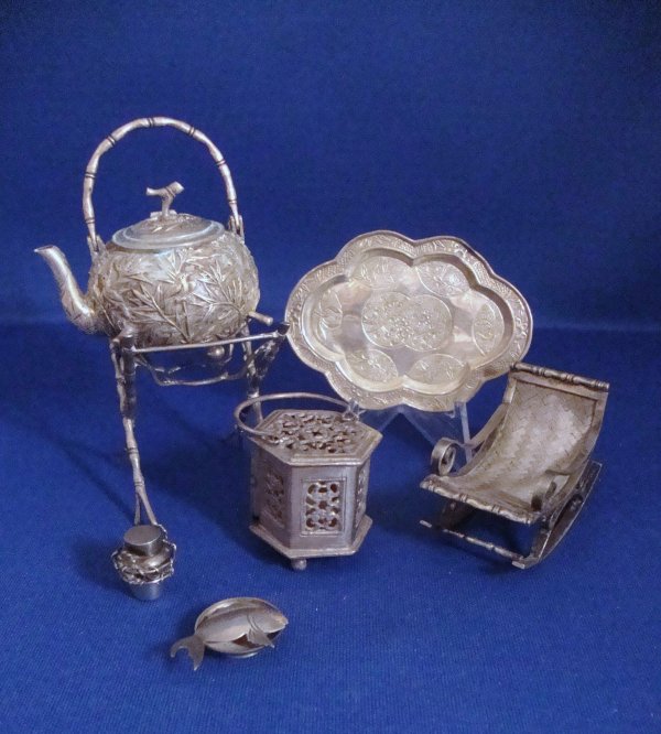 Grouping Chinese Export: Bird and floral chased teapot on stand, tray, rocking chair, incense burner, fish on tray, etc. 6 pieces 3.5" H.
