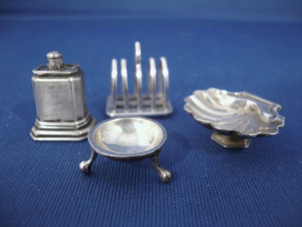 Meyers Sterling Strawberry Bowl, Tea Caddy, Toast: Shell-form strawberry bowl on stand, toast rack, tripod master salt, George I slip-top tea caddy, all with M mark & sterling on base, 3/4" H.