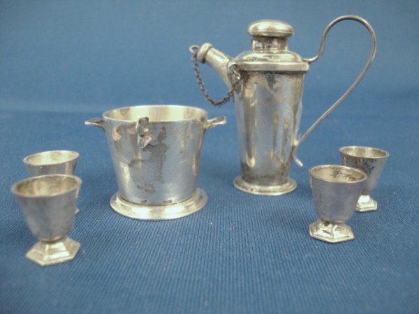Meyers Bar Accessories: Meyers barware: cocktail shaker, ice bucket with lid, ice tongs, and cocktail glasses, signed M & Sterling on bottom, 5" H.