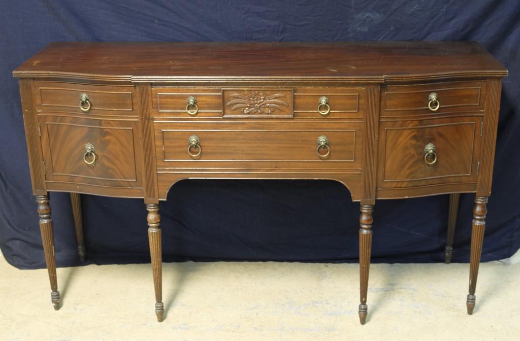Vintage Strawbridge Mahogany Sideboard: Vintage 1930's to 1940's mahogany sideboard with Strawbridge & Clothier label, nicely figured wood, two board top, bow front edge, top center drawer with carved bow and feathers over a single drawer, 