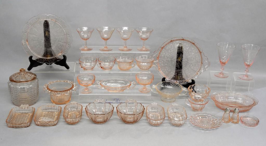 Lot Of Pink Depression Glass: Nice assortment of vintage pink depression glass, cups, glasses, goblets, plate, tray, covered crock, salt and pepper etc.