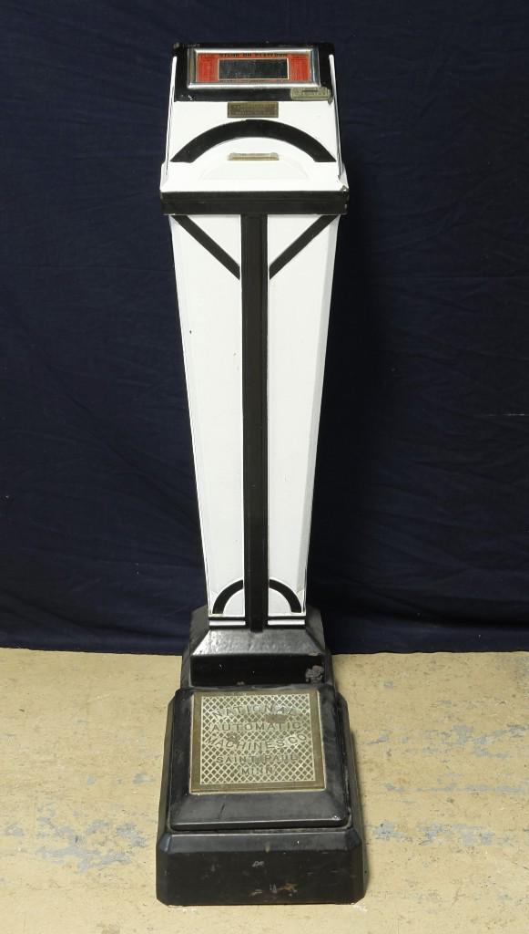 National Automatic Machines Coin Scale: Vintage National Machines Company, Saint Paul Minn., one cent coin scale from a drug store or arcade, 46"H, 12"W, 25.5"D, black and white porcelain finish, buyer must arrange shipping or pick-up