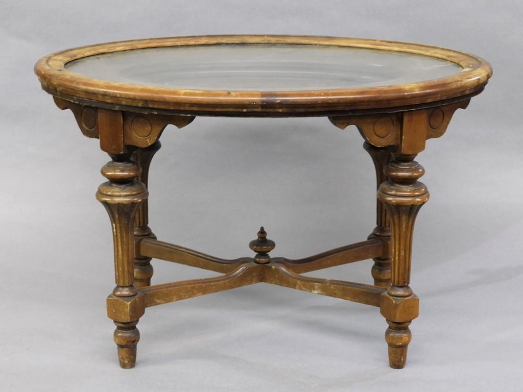 Carved Side Table & Display Case, buyer must arrange: Vintage oval side table has a carved biblical scene under removable wood framed glass tray 28.5"W, 19"D, 18.5"H, miniature wood curio cabinet with curved glass door and sides has two interior shelves 