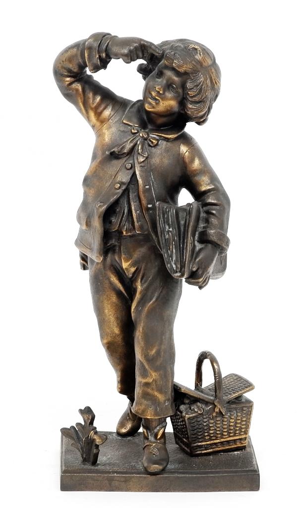 Vintage School Boy Statue: Vintage statue of a young school boy holding a large folio with a picnic basket by his feet, spelter with applied bronze patina 13.5"H