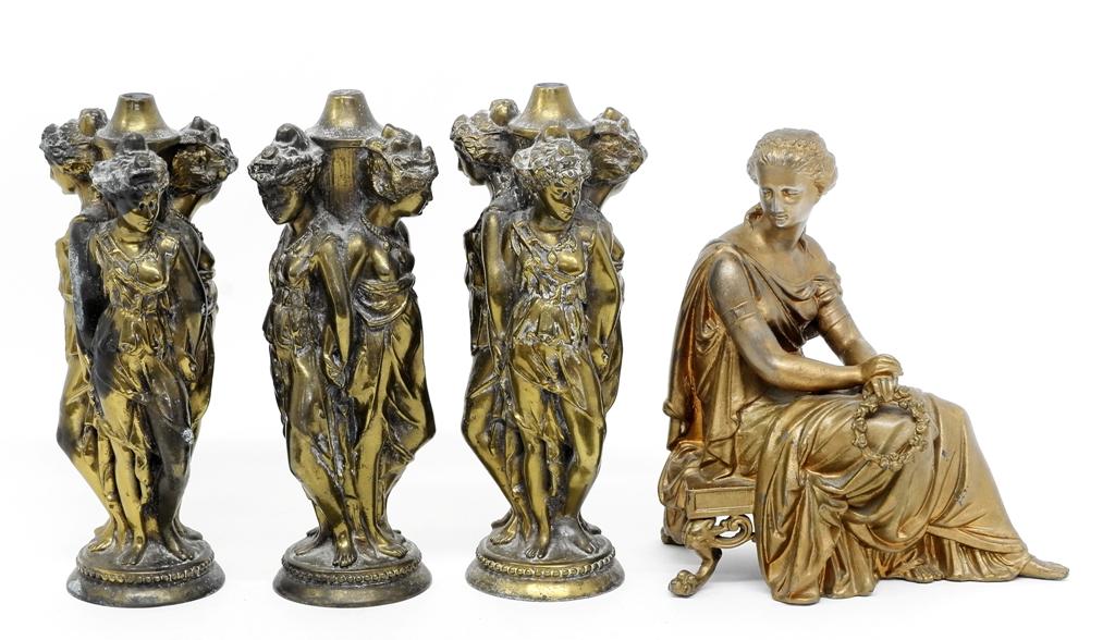 Antique Clock Topper & Garnitures: Antique figural clock topper of a maiden holding a wreath sitting on a low stool 10.5"H with old repaint, group of three garnitures, the three graces, cast spelter with applied patina 11.5"H