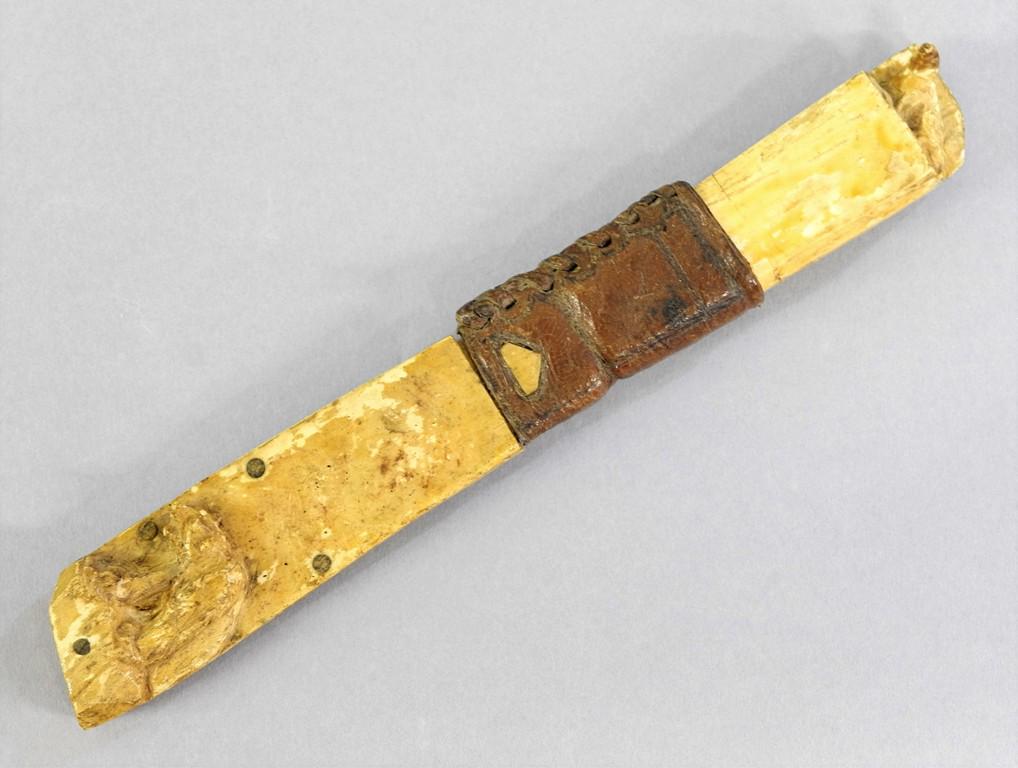 Carved Bone Antique Norwegian Knife: Antique belt knife with bone hand decorated with carved seals, scabbard decorated with carved bear, leather belt loop, blade engraved Kverneland Norge, 11.5"L overall