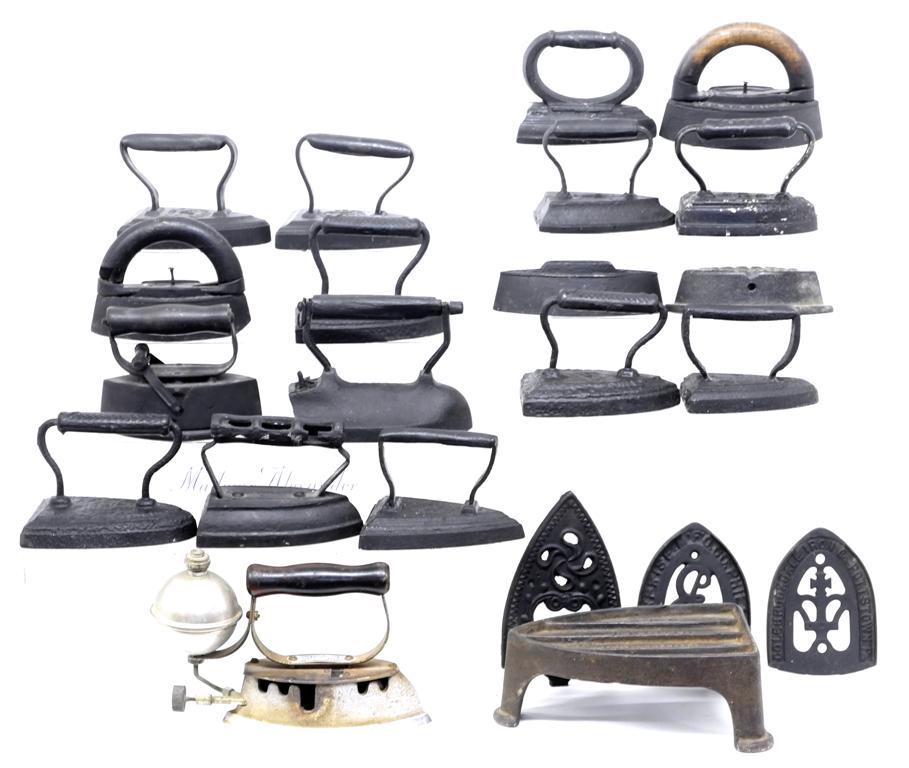 Collection of Antique Sad Irons: Group of 17 antique cast iron sad irons including a few signed examples, The Diamond Iron by The Akron Lamp & Mfg. Co. gas iron 11"L, also includes an antique iron trivet and three newer iron trivets,