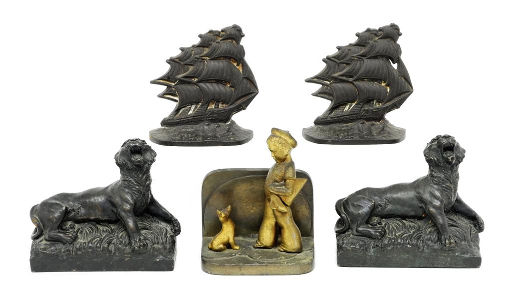 Antique Figural Book Ends: Pair of antique brass or spelter roaring lion bookends with applied dark patina 7"L, pair of cast iron sailing ship bookends signed Old Ironsides Corp 1929 5.5"W, single Frankart bookend of a young sa