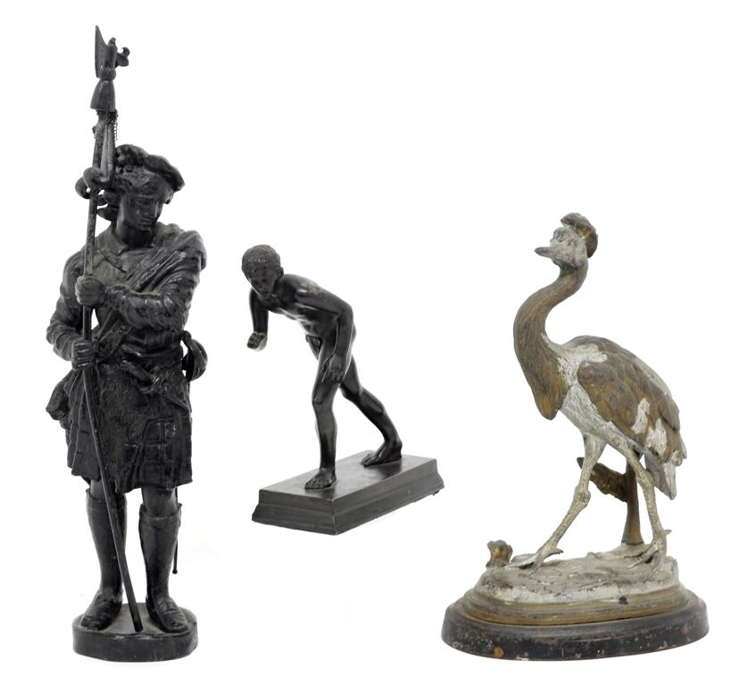Three Antique Figural Metal Statues: Antique soft metal sculpture of a runner with dark applied patina 6.5"H, painted soft metal crane on iron base 10"H, painted soft metal soldier with pole arm 15"H
