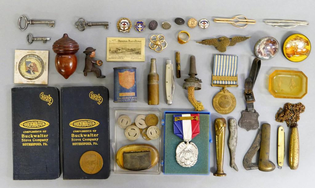 Group of Small Antiques & Collectibles: 1933 Ford Motor Company token, medals, tokens, brass seal, horn snuff box, wood acorn form thimble box, pocket knives, plumb bob, horse harness buttons, tin bottle form lighter, railroad fob, brass ea