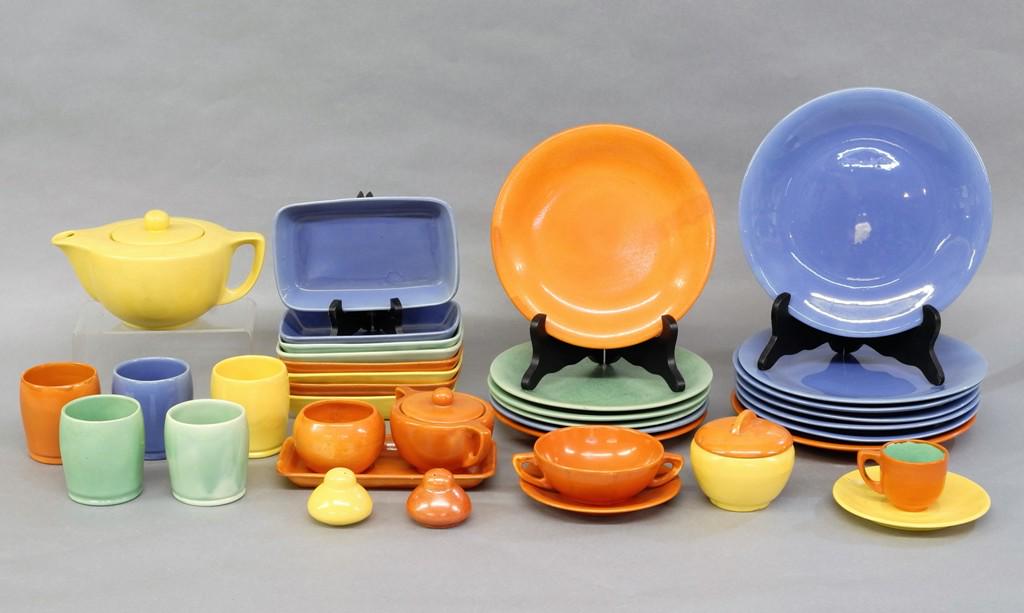 Stangl "2000" Dinnerware 38 Pieces: Vintage Stangl pottery in the "2000" pattern in assorted colors, includes 7 dinner plates, 6 luncheon plates, 1 bread plate, 8 - 7.5" rectangular dishes, teapot, sugar and creamer on tray, 5 tumblers,