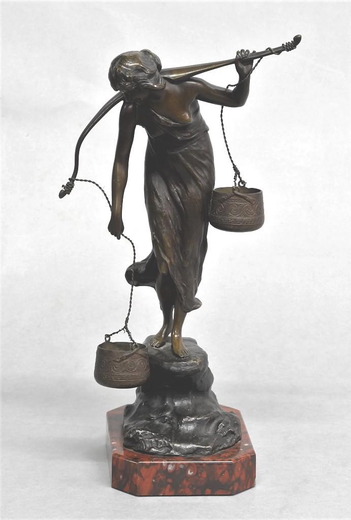 P. Kowalczewski Bronze Water Carrier Statue: Vintage signed P. Kowalczewski bronze statue of a young woman carrying two water buckets on a yoke, mounted on a marble base, 13.5"H