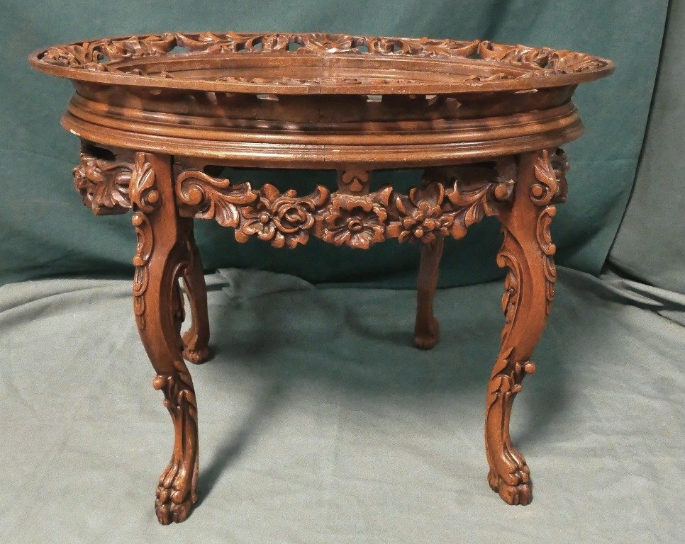 Highly Ornate Coffee Table with Glass Top: Wonderful Ornate Carved Coffee Table with Glass top Center of table has Putti with Neptune and fish Carved in Center. Beautiful Table 28x21" Top, 21 1/2" High . This is Charming and very well carved!