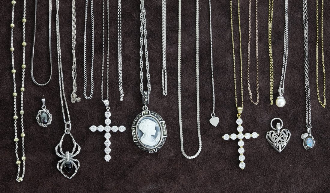 Seventeen Sterling Silver Necklaces, Some with Pendant: Seventeen Chains some with Pendants( one chain with Cameo and Marcasites)