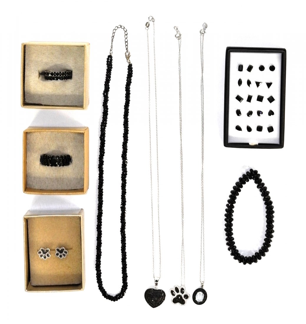 Collection of Beautiful Black Spinel On Sterling Silver: Beaded Necklace 17" Long, Matching Beaded Bracelet, Sterling Chain with Pendant of Light Colored Stone 9" Long. Heart Pendant on Sterling Chain 8" Matching Set of Paw Pendant and Earrings. Two Sets of