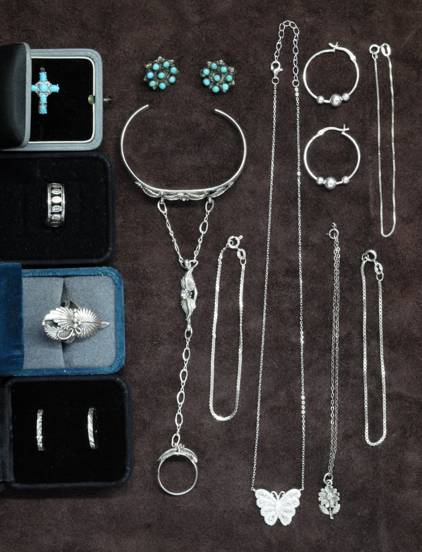 Collection of Sterling Jewelry: One Bracelet with Ring Attached, one Pair 24MM Three Hoop Earrings. One navajo Ring. Turquoise Ring & Clip Earring Three Sterling Rings Four Bracelets One with Pendant One Butterfly with Stones 7"Long