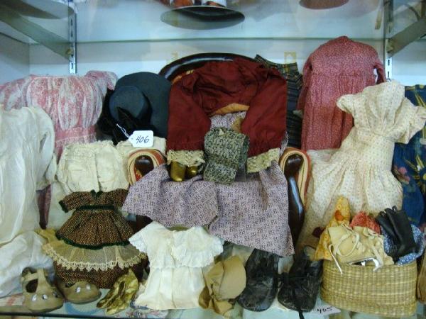 Early Doll Clothing: Calico doll clothing, white Victorian shoes, skates, incredible collection of early clothing, bonnets, hats, approximately 23 pcs.