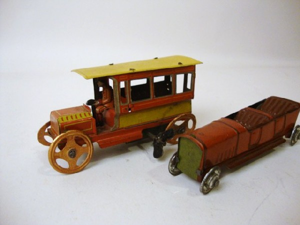 Two Tin European Penny Toy Vehicles: Tin European Penny toy wind-up Bus measures 4 1/2" l, Roadster measures 4" l