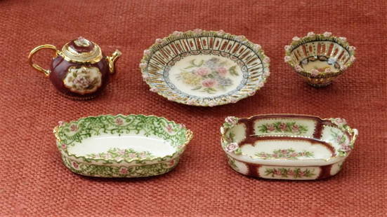 Welch Porcelain Dollhouse Miniatures: Three porcelain miniatures signed by both Jean and Teresa Welch, small deep pierced bowl with applied flowers on scalloped rim .5"D and two oval bowls with scalloped rims and delicate handles 1"L,