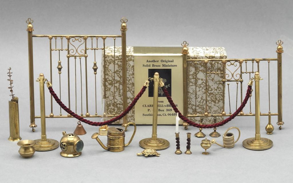 Dollhouse Brass Accessories Miniatures: Assorted dollhouse brass accessories include a well made diver's helmet, headboard with matching footboard, watering cans, candlesticks, spittoon, turtle, Clare-Bell whale weathervane in original box,