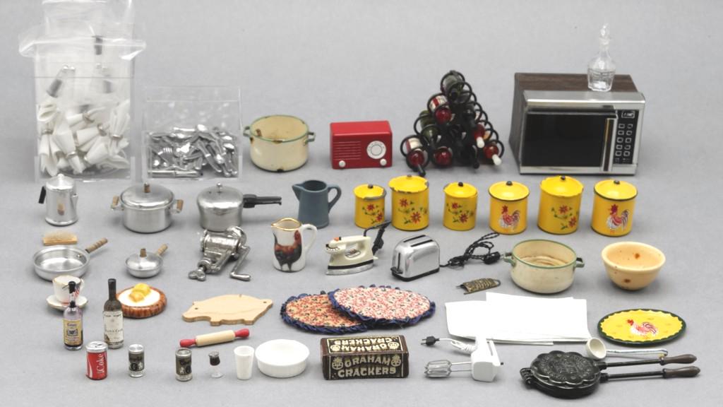 Large Lot Of Kitchen Accessories Dollhouse Miniatures: Small appliances include a microwave oven 2"L, radio, toaster, iron and mixer, rack full of wine bottles, large group of nicely made flatware, pots and pans, hand painted canisters, place mats and nap
