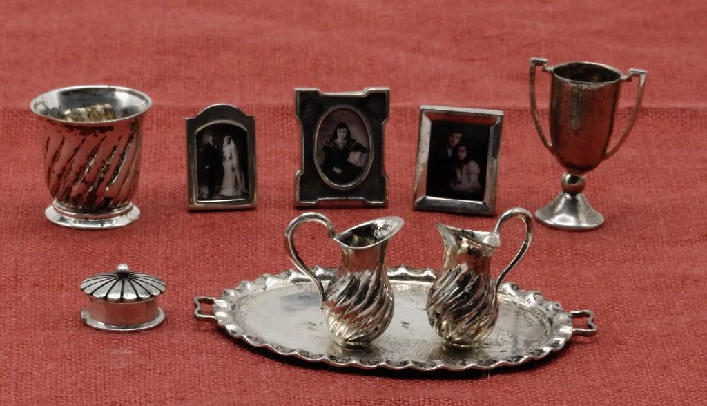 Enrique Quintanar Sterling Accessories Dollhouse: Nice selection of silver accessories all by Enrique Quintanar, oval tray 2.25"W, wine cooler, covered box, pair of pitchers, three picture frames and a loving cup 1"H