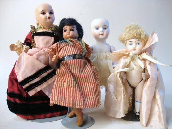 Grouping of Four Small Bisque Dolls: Grouping of four small dolls, 6" all bisque marked 103/6 painted eyes closed mouth jointed arms stiff legs w/gold Kestner boots no wig, 4 1/2" all bisque marked SWC painted eyes open mouth original wi