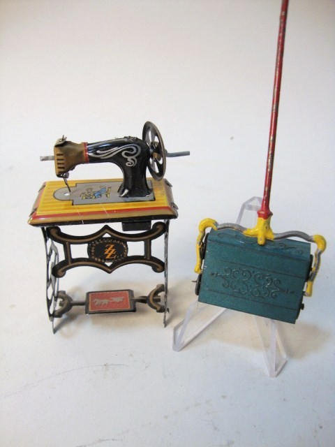 Penny Toy Sewing Machine, Sweeper: Penny toy tin sewing machine marked Germany and a tin sweeper made in France, 5" t